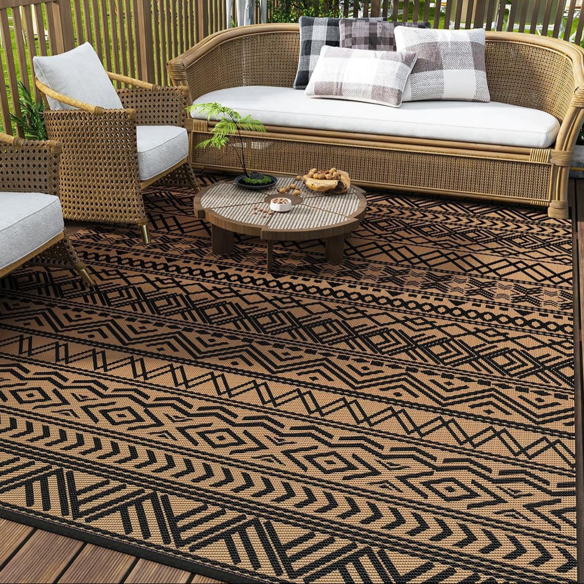 Enhance your patio with the Geometra Washable Outdoor Rug, featuring a stylish black and coffee pattern. Perfect for any space!